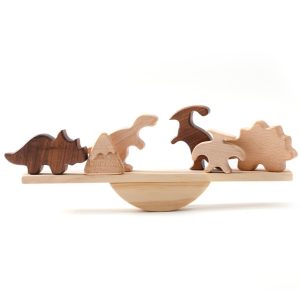 Jouet en bois, bloc d'équilibre, dinosaure, avec 5 dinosaures tenant en équilibre sur une planche en bois