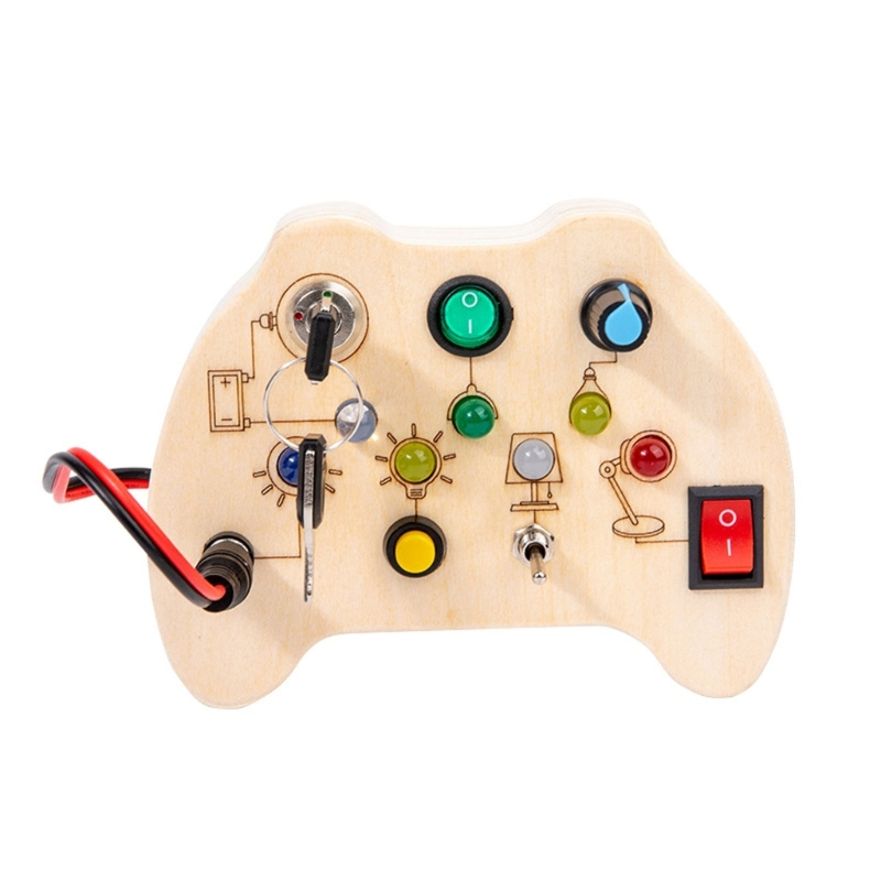 Un busyborad en bois en forme de manette de jeux avec des boutons et des petites lumières